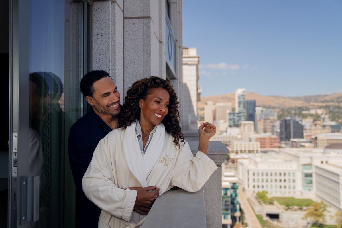 Couple in robes enjoying the view from the balcony