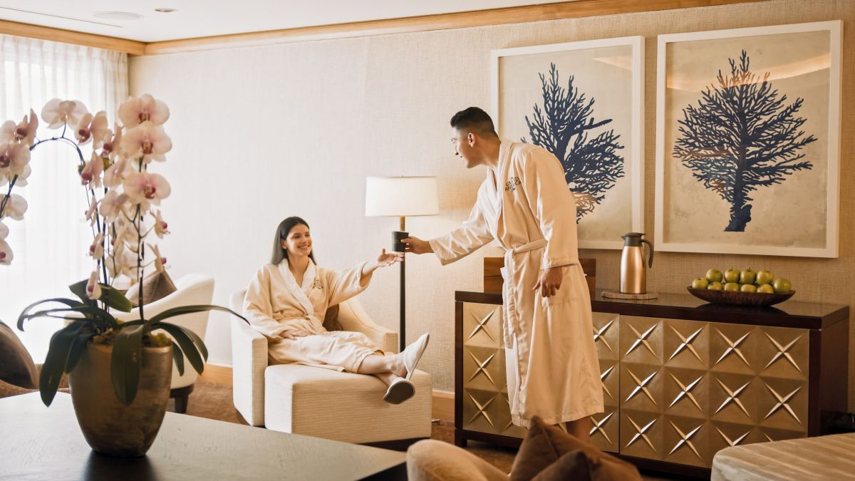 Couple in robes doing a cheers