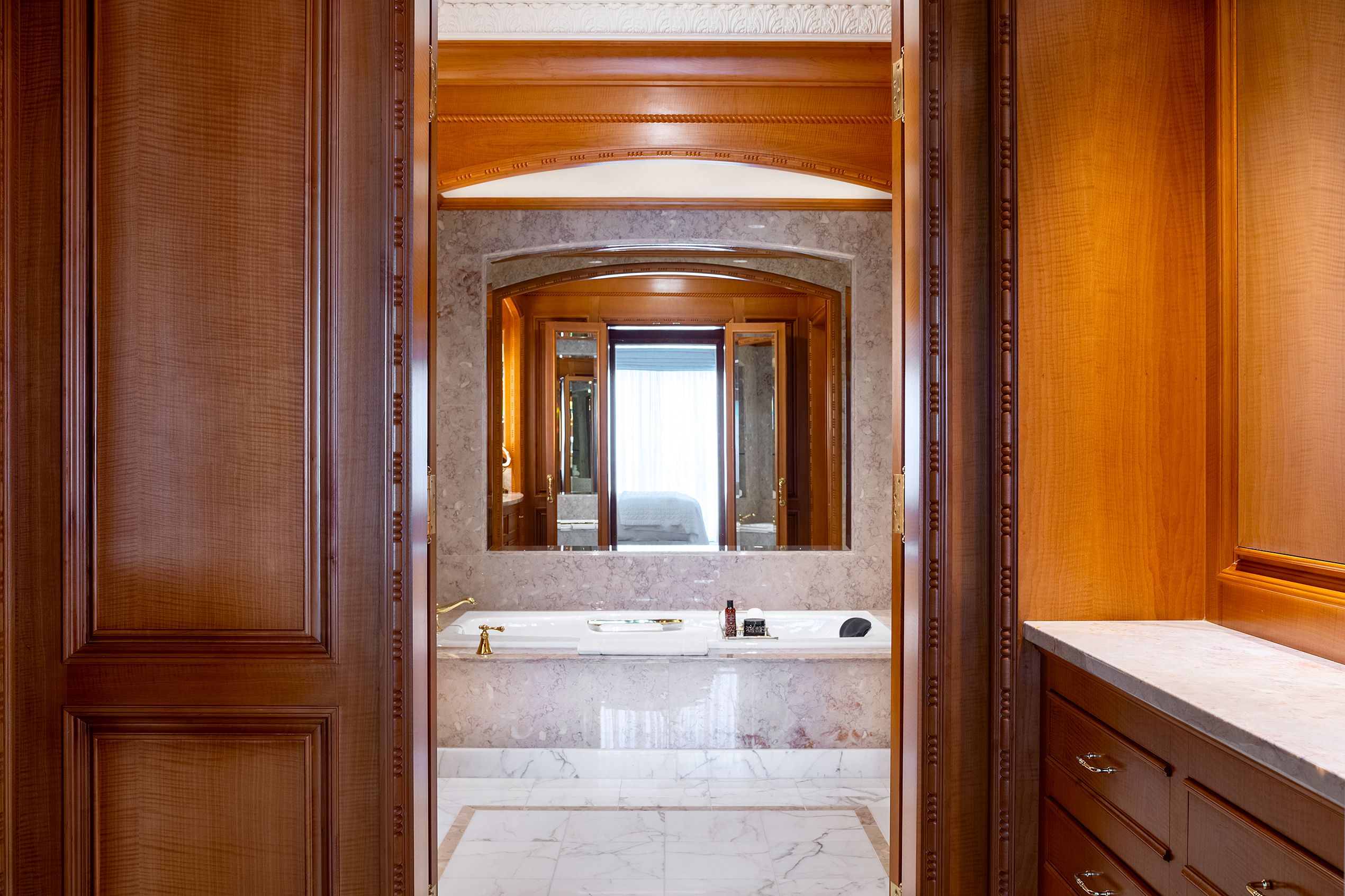 Presidential Suite Bath Tub through wooden doorway