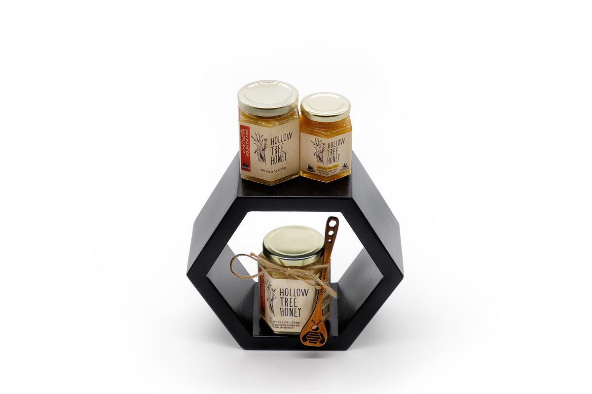 Jars on honey on a hexagon shelf