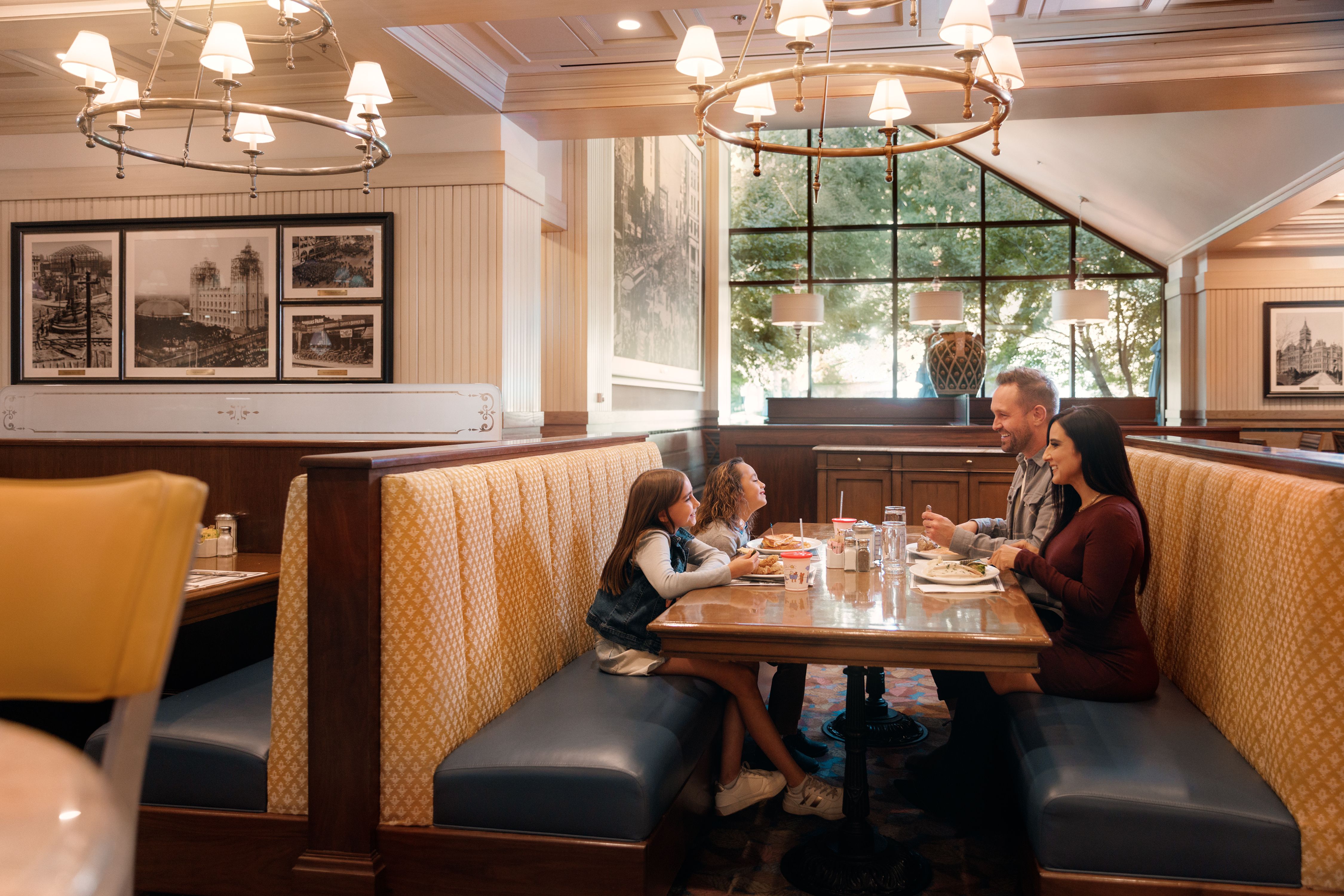 Family eating a meal together in a booth