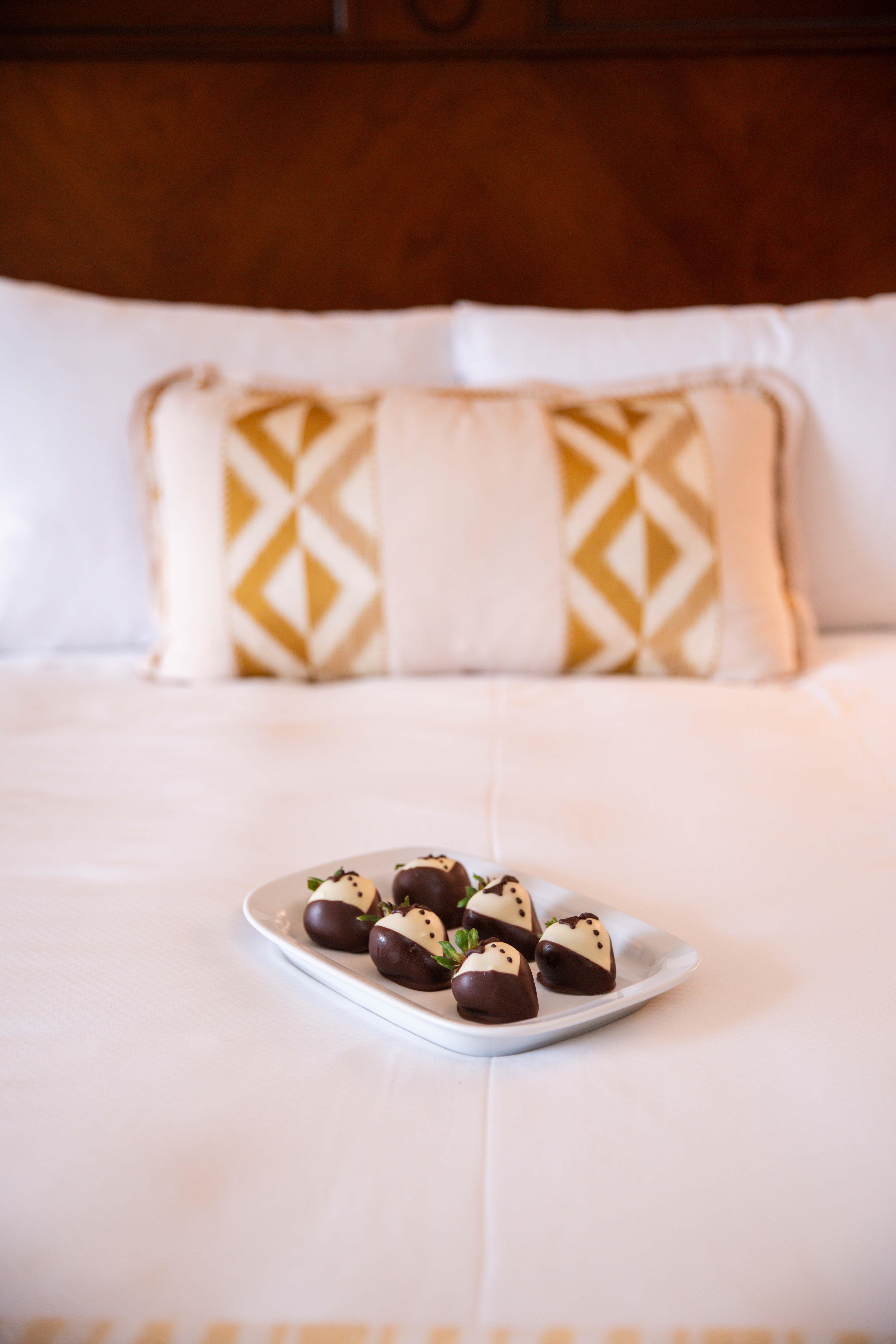 Bed with chocolates on it